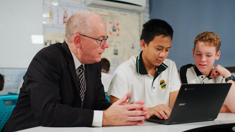 student and teacher in class
