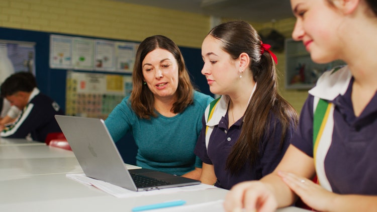 student and teacher in class